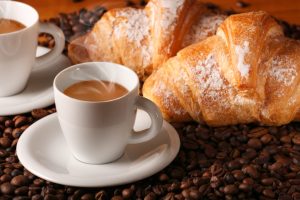 Typical Italian breakfast of espresso coffee and a pastry